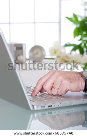 man using notebook at home, office