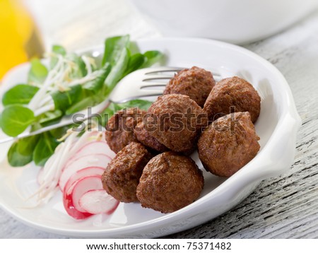 vegetarian meatballs with slice radish, soy sprout and salad