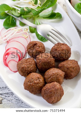 vegetarian meatballs with slice radish, soy sprout and salad