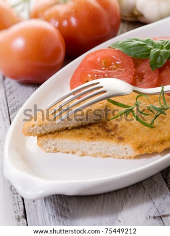 slice vegetarian cutlet with slice tomatoes