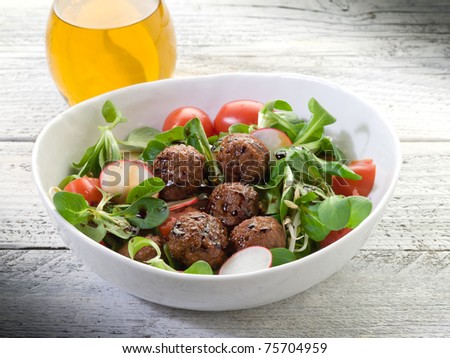 mixed salad with vegetarian meatballs slice radish and  soy sprout