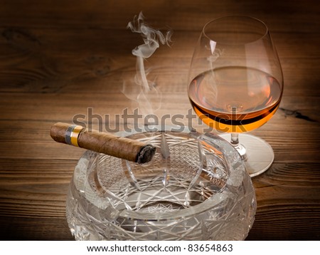 Cuban cigar and liquor drink on wood background