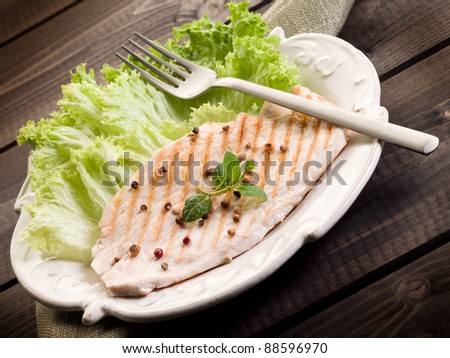 healthy food chest of grilled chicken and lettuce