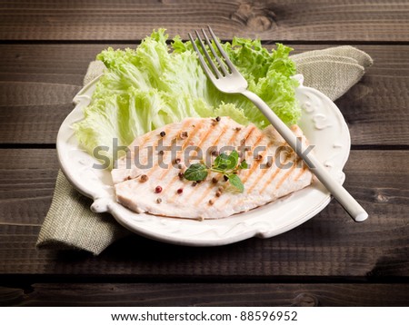 healthy food chest of grilled chicken and lettuce