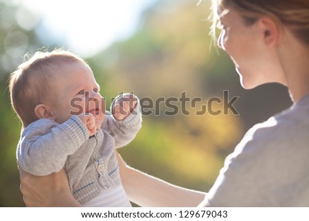 Mother and baby in park portrait Mother and baby in park portrait