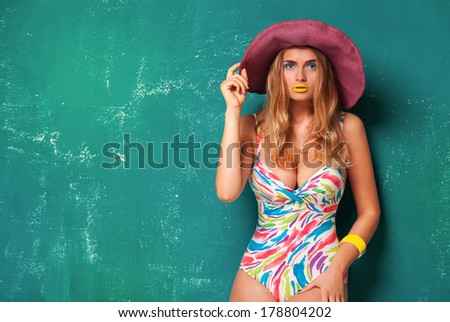 portrait of a girl in a hat, summer style, on green background