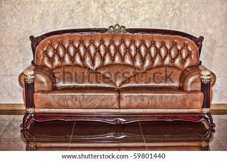 Antique leather brown sofa in the room