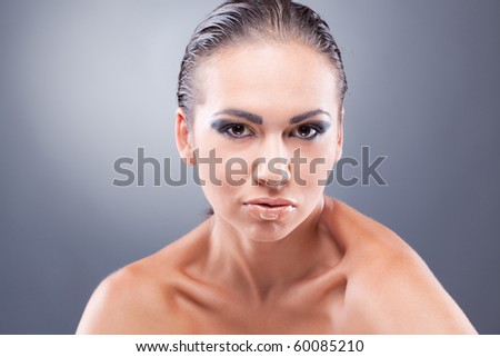 Closeup portrait of confident sporty brunette woman looking at camera