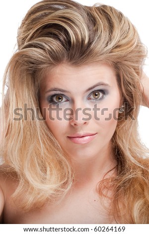 stock photo : Tempting blonde young woman with large grey eyes holding hair 