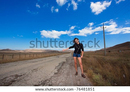 woman stop the car on old mountain road
