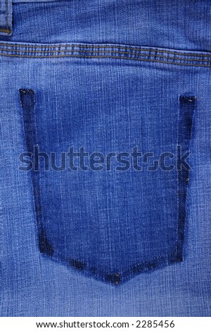 Close-up of the pockets of old jeans skirt. Fabric texture