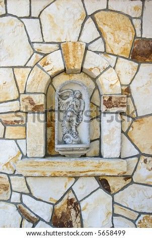 Wall decoration with bas-relief of angel