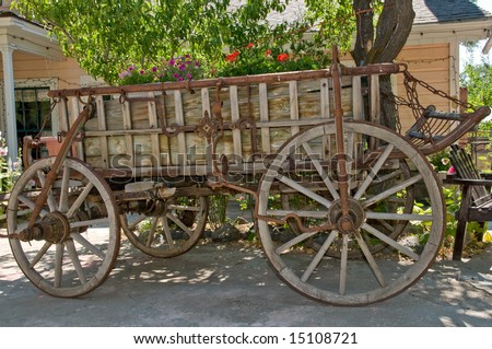 antique wooden wagon placed as decoration in front yard