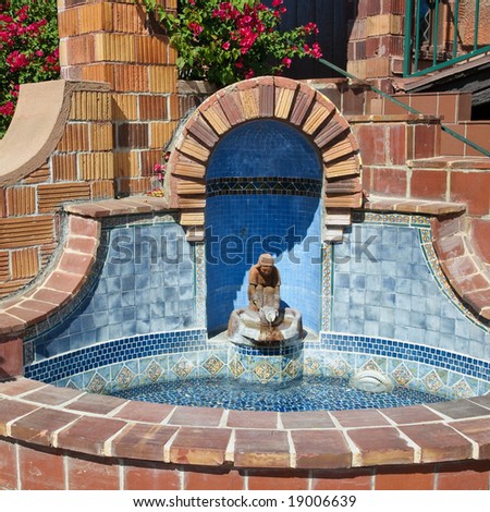 Spanish style fountain with sculpture