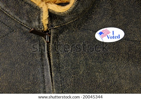 leather-like jacket with I Voted sticker - closeup details