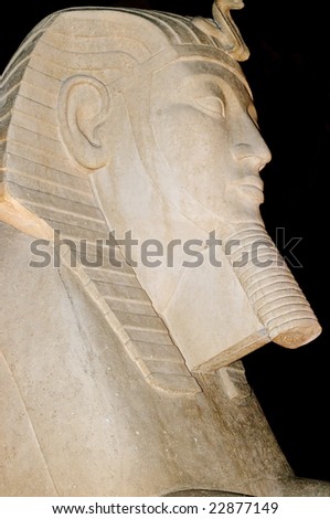 Replica of ancient Egyptian sculpture - isolated against black
