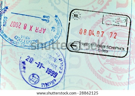 Visa stamps on page of USA passport - closeup