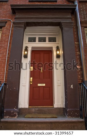 Classic wooden door with bronze handles in old New York townhouse