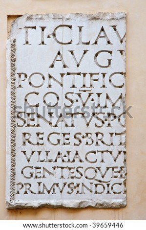 Fragment of ancient Roman inscription carved in marble slab - Rome, Italy