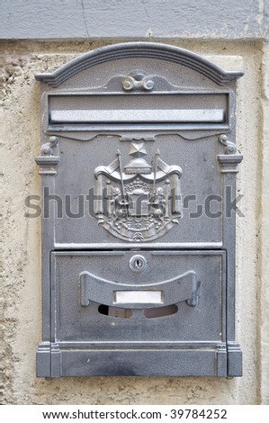 Vintage mail box on old stucco wall in Italy