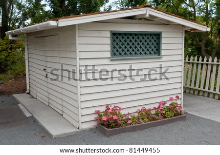 Rustic wooden shed in backyard