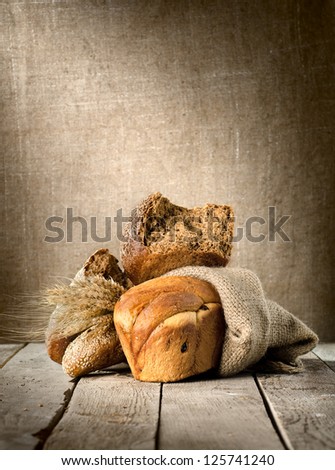 Bread assortment on background of the old canvas