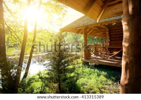 Wooden house and pond