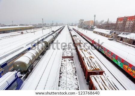 Cargo train platform at winter, railway - Freight tranportation