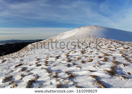 WInter mountains landscape with blue sky in summer sunny day