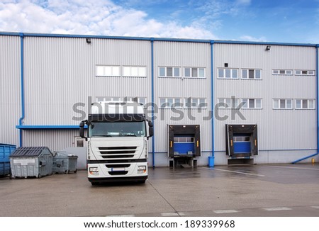 Shipping cargo truck at warehouse building