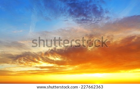 Sky with dramatic cloudy sunset and sun