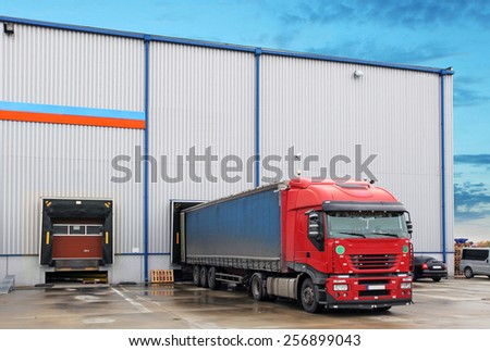 Cargo truck at warehouse building