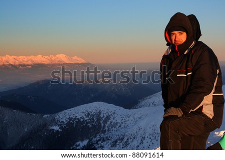 Single man on top of snow ice winter mountain. Chopok - Jasna