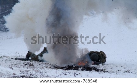 WWII Soldier in a winter setting. (a mortar explosion kills two men and shakes teh camera)