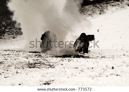 An old, sepia, and grainy WWII photo of American Soldier running for cover from mortar explosions