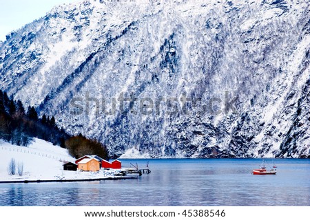 Small boat in the fjord in Norway, winter