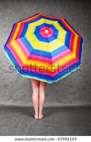 Rainbow umbrella and girl\'s feet