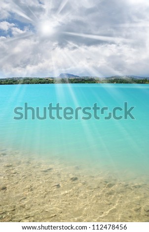 blue water of the lake under cloudy sky