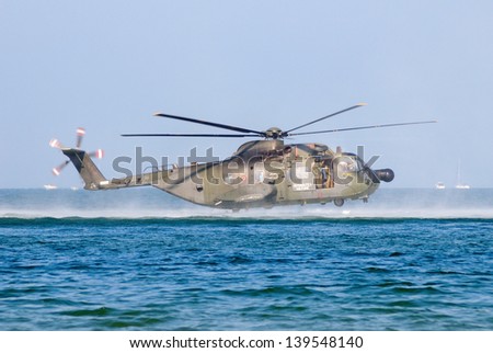 RIMINI, ITALY - SEPT 9: Air Force helicopter landing on the sea during \