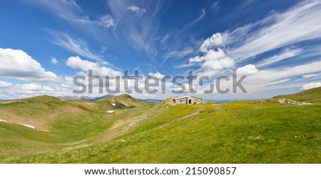 isolated mountain refuge under amazing sky