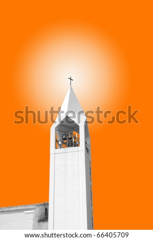 bell tower isolated on the orange sun