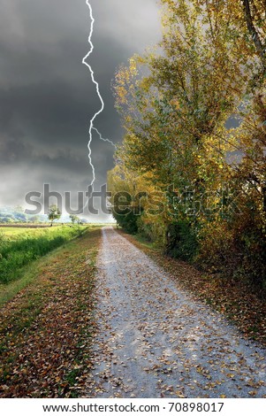 street in countryside with storm incoming