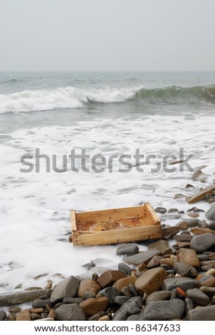 wooden box on the shore after the storm