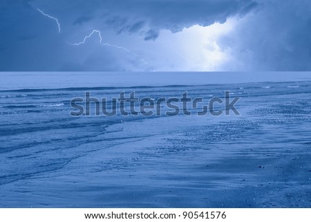 lightning in the night over the sea