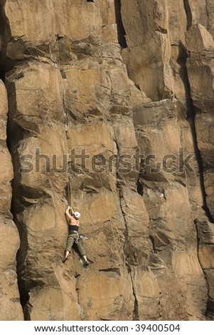 Women climbing the wall