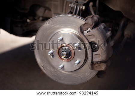 Front Disk brake assembly on a modern car - Brake job in progress