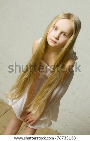 Child girl with long blond hair - natural beauty