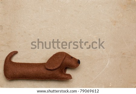 Dog toy on old paper background