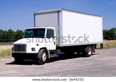This is a picture of a typical six wheel city delivery cargo vehicle with a blank white van box.
