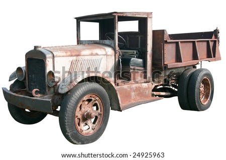 This is an old 1920s dump truck tipper in great disrepair, isolated on a white background.
